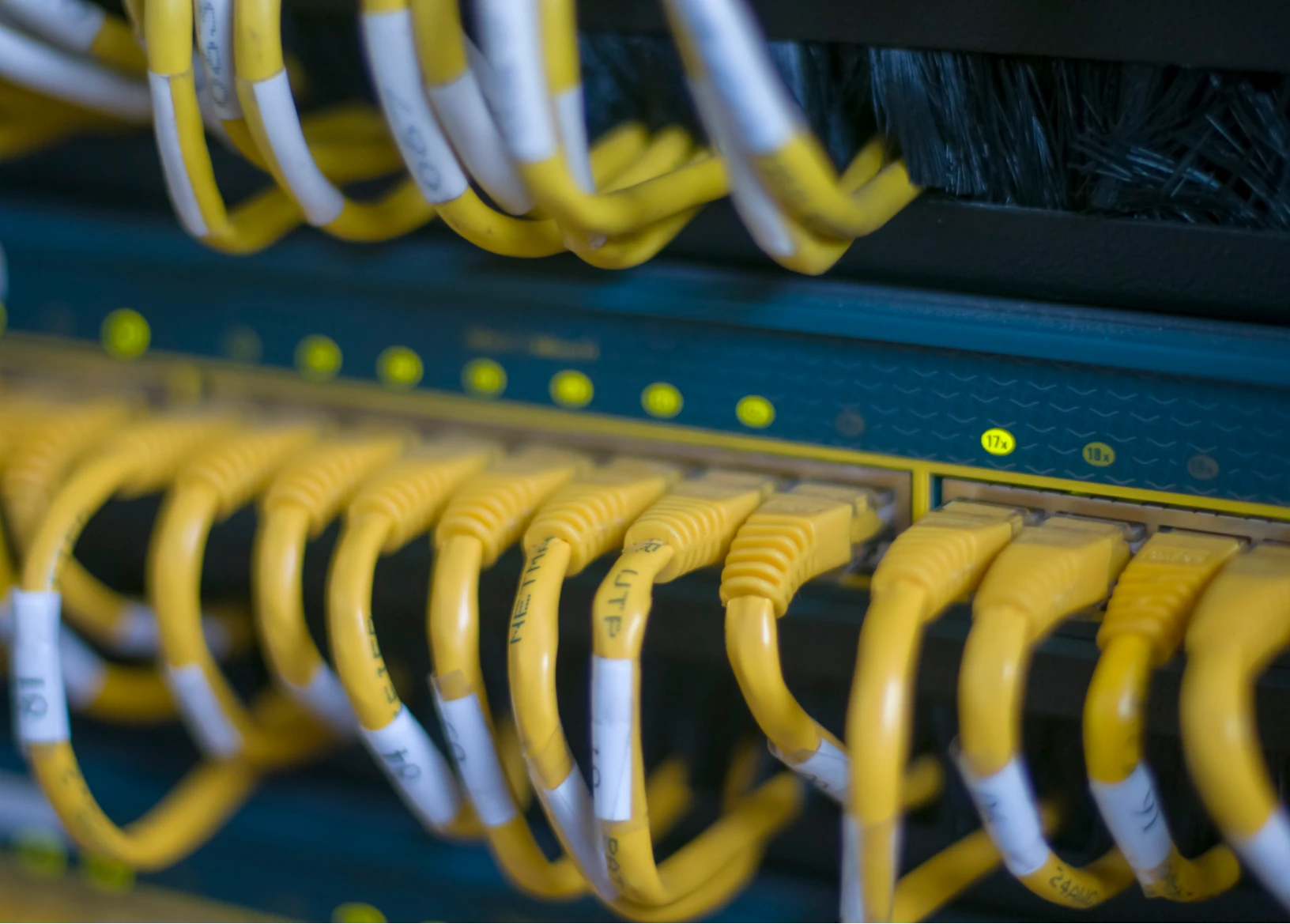 Yellow Ethernet cables in a network switch
